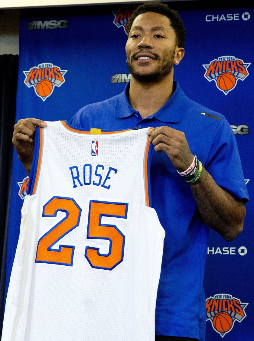 Derrick Rose poses for photographers with his New York Knicks jersey during a news conference on June 24, 2016 in New York. The Knicks introduced Rose, the former NBA basketball MVP they acquired from the Chicago Bulls. | Mary Altaffer/Associated Press