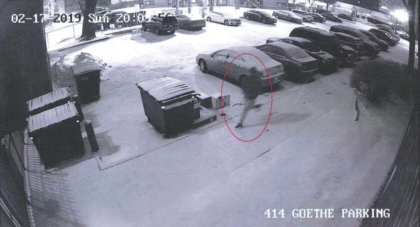 Still from a surveillance video allegedly showing Gaston Tucker running through a parking lot after fleeing a traffic stop Feb. 17, 2019, in Old Town.