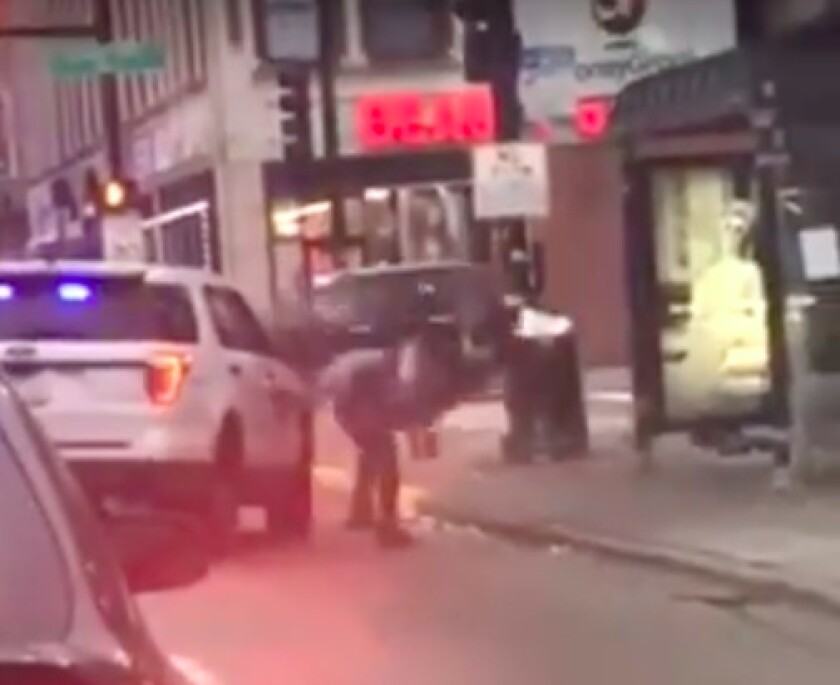 An image taken from a cellphone video that was posted to social media Nov. 28, 2019, shows a Chicago police officer lift a man off his feet and slam him to the ground after he allegedly spit on the officer while being detained for drinking in public.