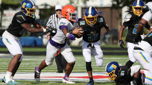 Morgan Park's Raymond Gilbert, left, sacks Simeon's Aki King.
