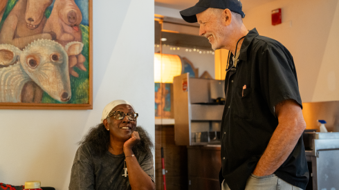 Joel Nickson, owner of Wishbone, speaks to Jacqui Grant, a longtime customer, at Wishbone in the West Loop, Thursday, August. 6, 2026.