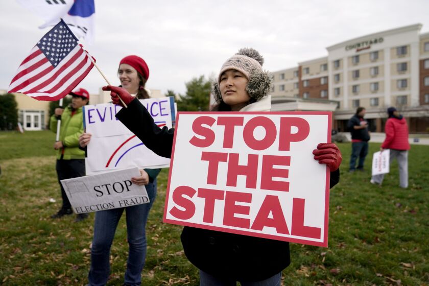 Supporters of President Donald Trump gather outside of the Wyndham Hotel where the Pennsylvania State Senate Majority Policy Committee is scheduled to meet, Wednesday, Nov. 25, 2020, in Gettysburg, Pa.