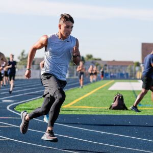 Plainfield South’s Niko Schultz sprints around the curve of the track during practice.