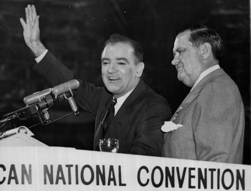 U.S. Sen. Joseph McCarthy (with hand raised) in an undated photo.