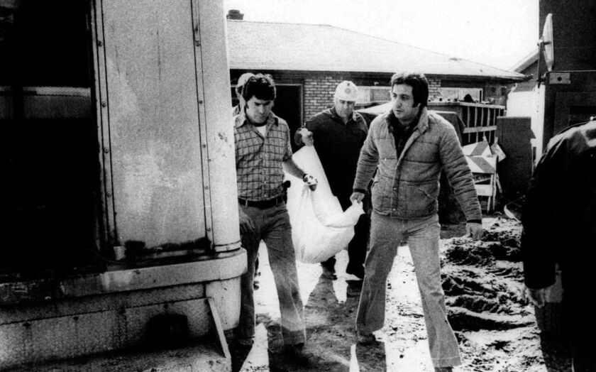 Cook County sheriff’s police remove the remains of a body found under an addition to the home of serial killer John Wayne Gacy. | AP