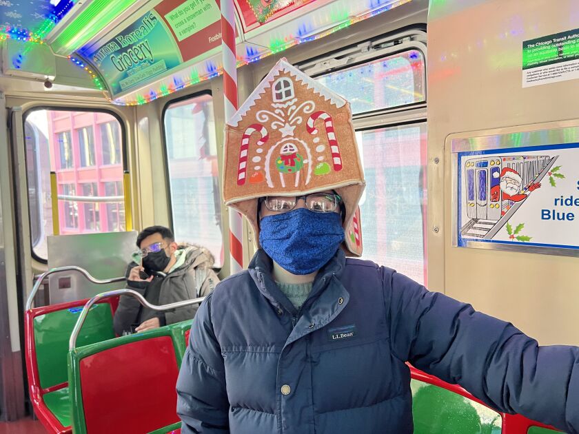 Ryan Newport, 11, sports a gingerbread house hat on the CTA holiday train Dec. 20.