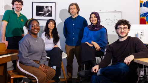 The Truth & Documentary team sits in their production studio in Chinatown’s Blue Star warehouse. From left: intern Kieran Stover, Kyra Mitchell, Ysa Quiball, Ben Kolak, Fatima Omar and Ian Resnick.