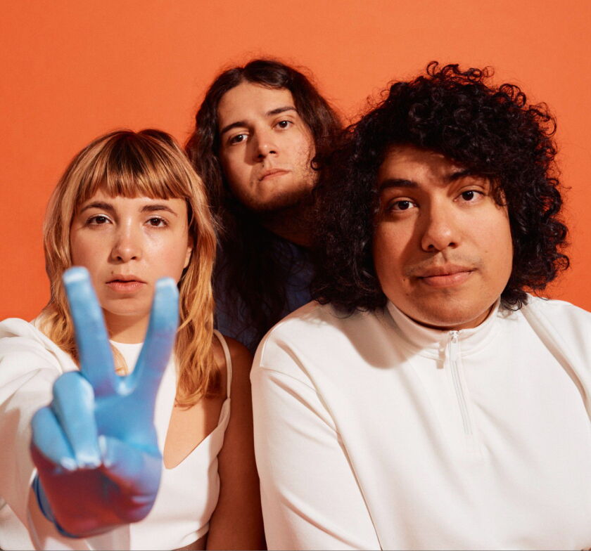 Lili Trifilio (left) plays in Beach Bunny along with Anthony Vaccaro and Jon Alvarado.