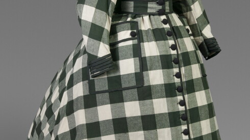 A floor-length green and white plaid dress with long sleeves