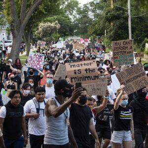 Protesters march around Kenosha in the second night of unrest after police shot Jacob Blake, Monday night, Aug. 24, 2020.