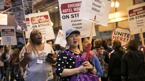 Hotel workers, represented by Unite Here Local 1, strike outside the Palmer House Hilton, Friday morning, Sept. 7, 2018.
