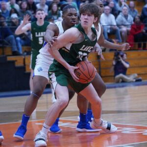 Lane’s Louis Perona (23) spins towards the basket against Proviso East, Wednesday 02-27-19. Worsom Robinson/For Sun-Times