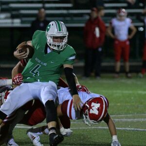 Notre Dame’s Ty Gavin (4) gets tripped. Worsom Robinson/For the Sun-Times.