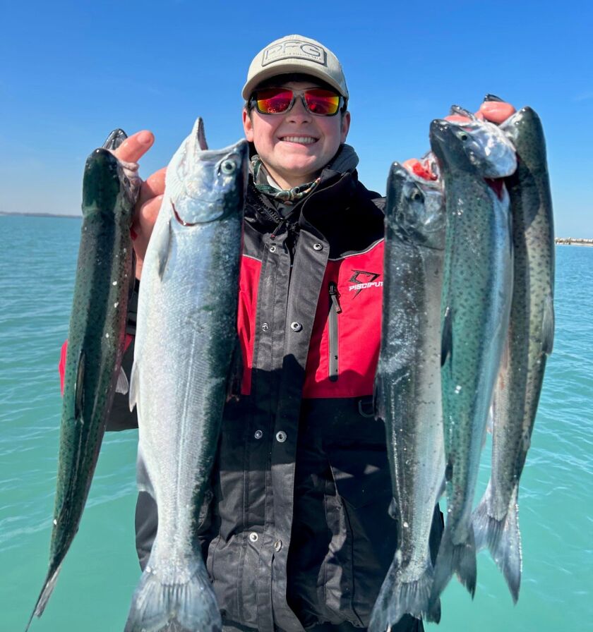 Casey Shell with five coho from southern Lake Michigan. Provided photo