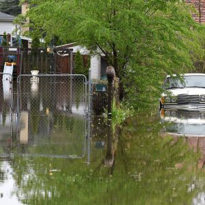 Backyards along Rand Road in Des Plaines are flooded from an overrun Des Plaines River Monday.