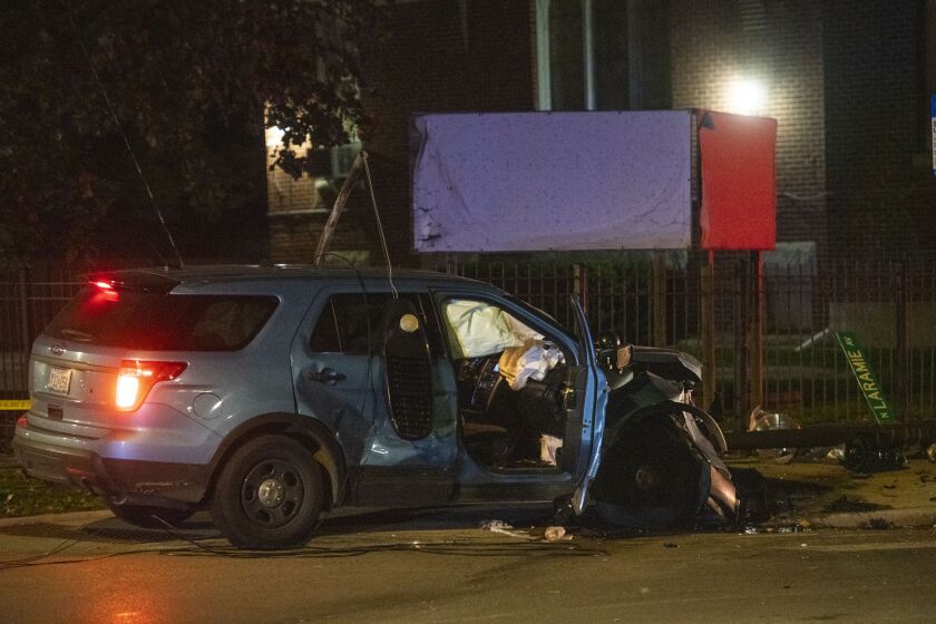 Chicago police respond to the scene of a vehicle accident involving a police cruiser in the 5100 block of West Fulton Street, in the South Austin neighborhood, Monday, Nov. 1, 2021.