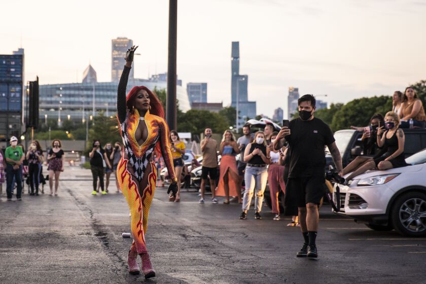 Jaida Essence Hall, winner of the twelfth season of RuPaul’s Drag Race, walks through the socially-distant crowd during Drive ‘N Drag presented by Voss Events at Soldier Field, Friday night, Aug. 7, 2020.