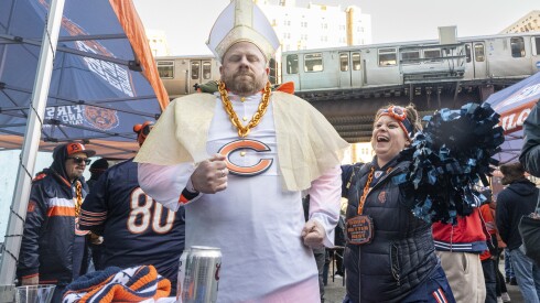 Tarek Sayed, dressed as the pope, dances during a tailgate party at a parking lot at 524 S. Wabash Ave. in the South Loop ahead of the Chicago Bears and Green Bay Packers wildcard game, Saturday, Jan. 10, 2026.