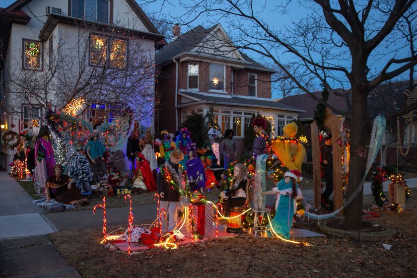 Jim McCall’s Christmas display made of old dressed-up mannequins covers the yard in front of his West Rogers Park home. | Nader Issa/Sun-Times