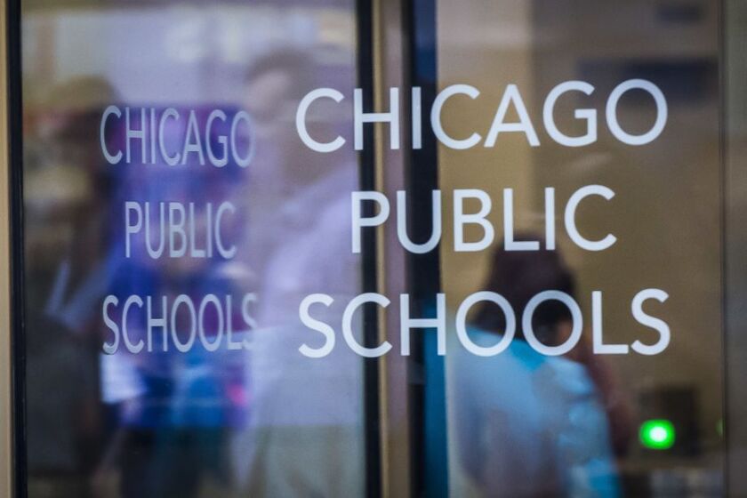 Chicago Public Schools announced Friday that it had laid off 161 workers and eliminated 209 vacant positions in an effort to fill a $734 million budget shortfall.