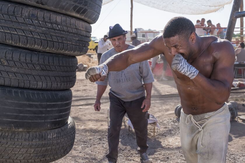 Rocky Balboa (Sylvester Stallone) continues to train Adonis (Michael B. Jordan) in “Creed II.” | MGM/Warner Bros.