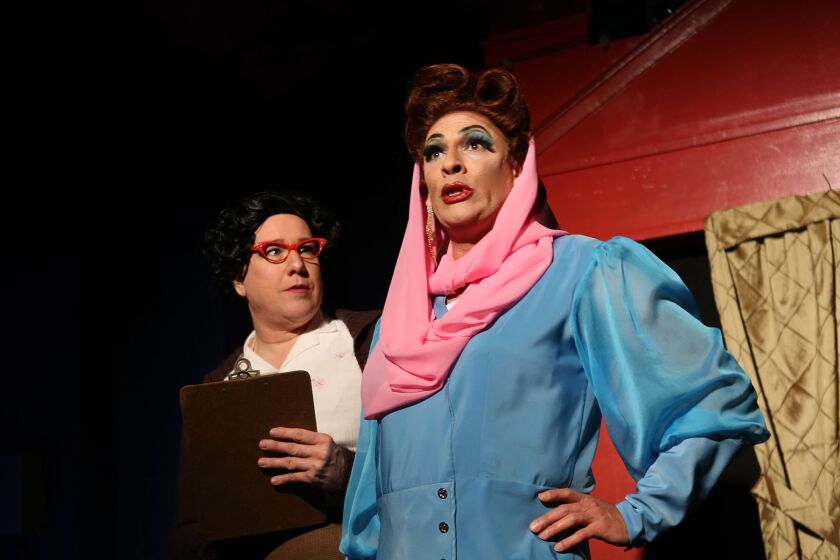 Ed Jones (left) and David Cerda in a scene from “Christmas Dearest.”