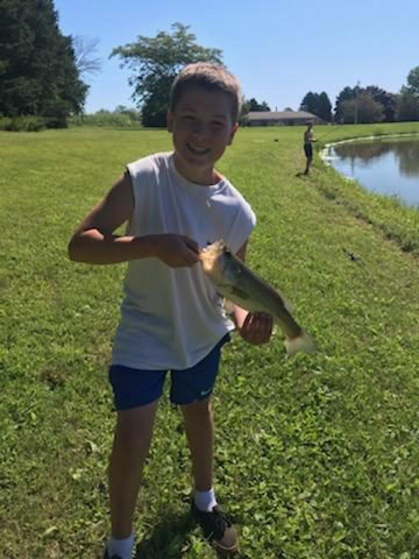 Bryce Wojtiuk holds his first largemouth bass. Provided photo