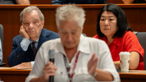 Ald. Nicole Lee (11th) sits beside Cook County Commissioner John Daley during an Illinois Sports Facilities Authority board meeting at Rate Field in Bridgeport.