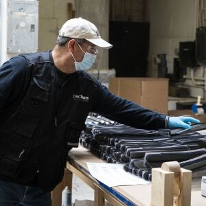 Juan Baez, a furniture maker at Pac Team, makes face shields at the factory at 4447 W. Armitage Ave. on the Northwest Side, Tuesday afternoon, March 31, 2020.