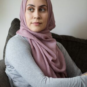 Felicia Salameh sits in her Orland Park, IL home on June 5, 2018. It is the middle of Ramadan, and her children are out of school on their summer break. I Maria de la Guardia/Sun-Times