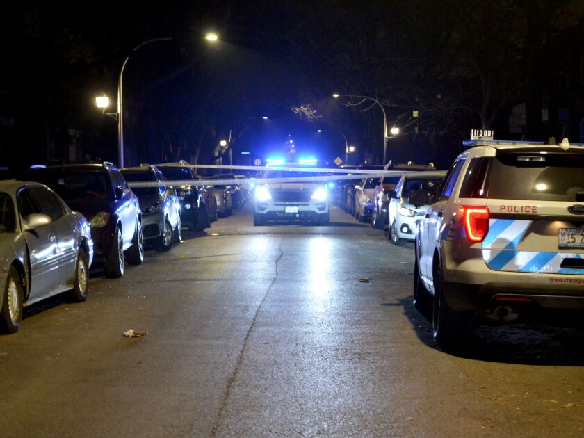 Chicago police investigate the scene where a person was shot Saturday night in the 4700 block of West Gladys, in the West Garfield Park neighborhood. | Justin Jackson/ Sun-Times