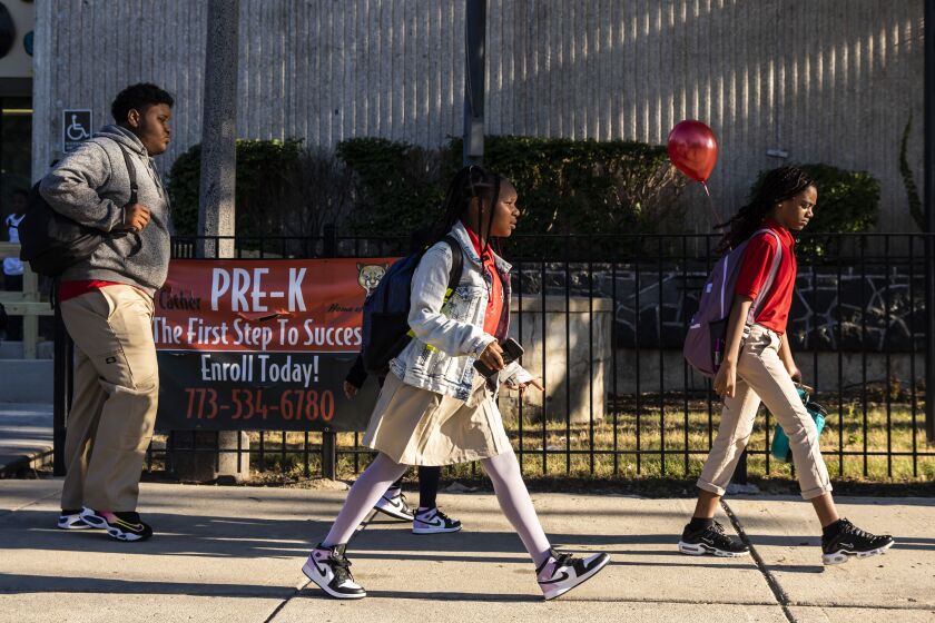 Parents and students arrive at Willa Cather Elementary School, 2908 W. Washington Blvd. in East Garfield Park, for the first day of school for Chicago Public Schools, Monday morning, Aug. 22, 2022.