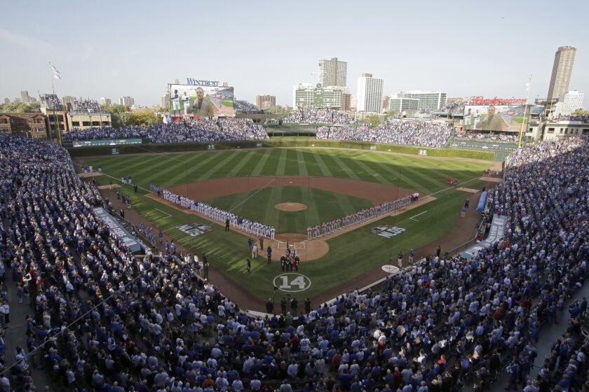 The Chicago Cubs and St. Louis Cardinals at Wrigley Field during the national anthem before Game 3 in baseball’s National League Division Series in 2015.