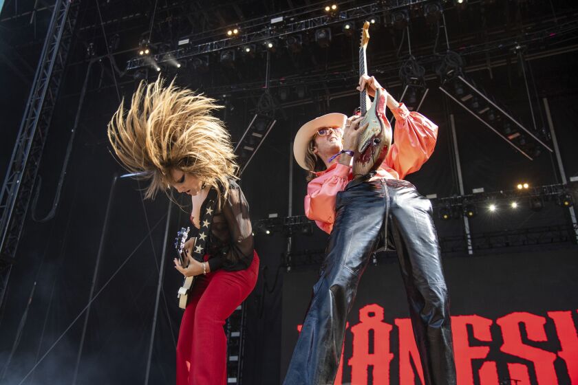 Victoria De Angelis (left) and Thomas Raggi of Måneskin perform on Day 4 of Lollapalooza 2022 in Grant Park.