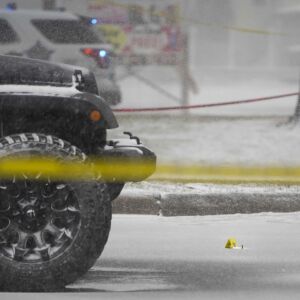 Chicago police investigate the scene where an off-duty Chicago police officer was shot in the 8900 block of South Stony Island Ave. in Calumet Heights, Monday, March 15, 2021.