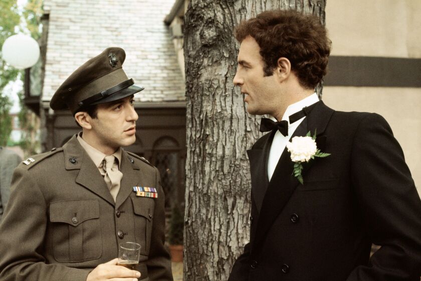Al Pacino as Michael Corleone (left) and James Caan as Sonny Corleone in a scene from “The Godfather.” Caan, whose roles included ‘The Godfather,’ “Brian’s Song” and “Misery,” died Wednesday at age 82.