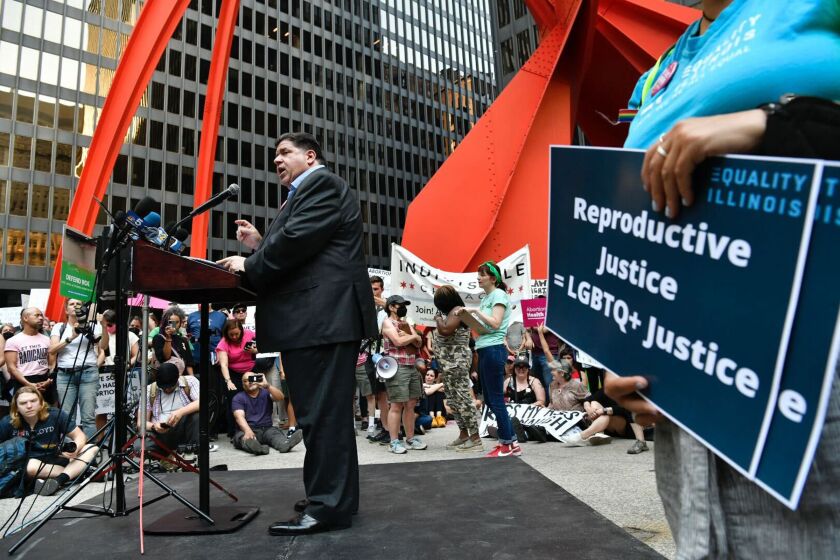 Gov. J.B. Pritzker addresses an abortion rights rally at Federal Plaza on Friday, June 24, 2022.