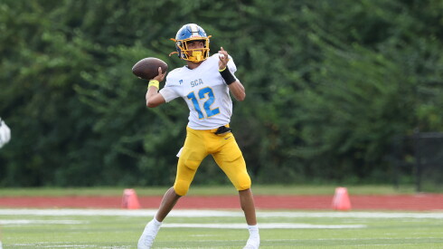 Simeon's Aki King looks to throw downfield against Morris.