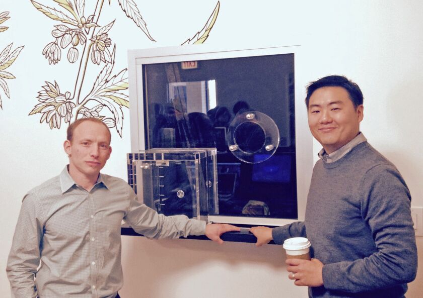 Zachary Zises and Paul Lee, owners of Chicago’s first marijuana dispensary, are shown at the transaction window. | Mitch Dudek/Sun-Times