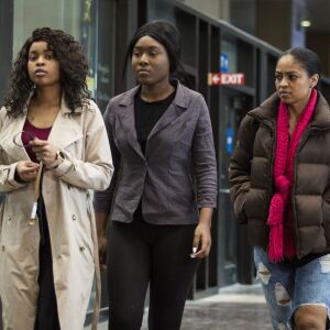 R. Kelly accuser Jerhonda Pace (left) walks into the Leighton Criminal Courthouse, as Alice Clary (right) walks alongside, for the R&B star’s first court appearance following his arrest on charges he sexually abused four people, including three