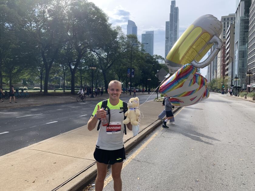 Zachery Panning celebrates after finishing 11th among men in the 43rd Chicago Marathon on Oct. 10, 2021.