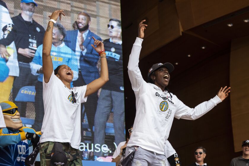 Candace Parker and Kahleah Copper cheer as the Chicago Sky players celebrate their WNBA Championship title at Pritzker Pavilion, Tuesday, Oct. 19, 2021.