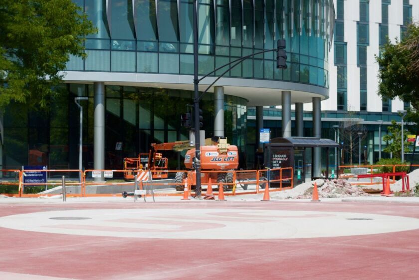 Streetview of a new graded intersection embedded with the University of Illinois at Chicago logo at the intersection of Harrison and Morgan Streets on the school’s campus.