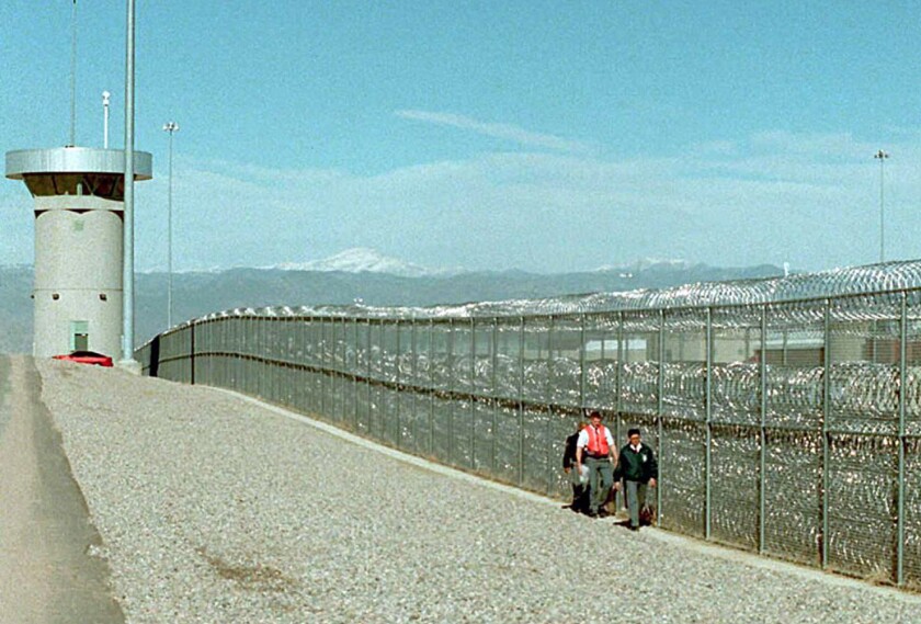 Guards walk along the fence at the super-maximum-security federal prison in Florence, Colorado, where Jeff Fort is being held. 
