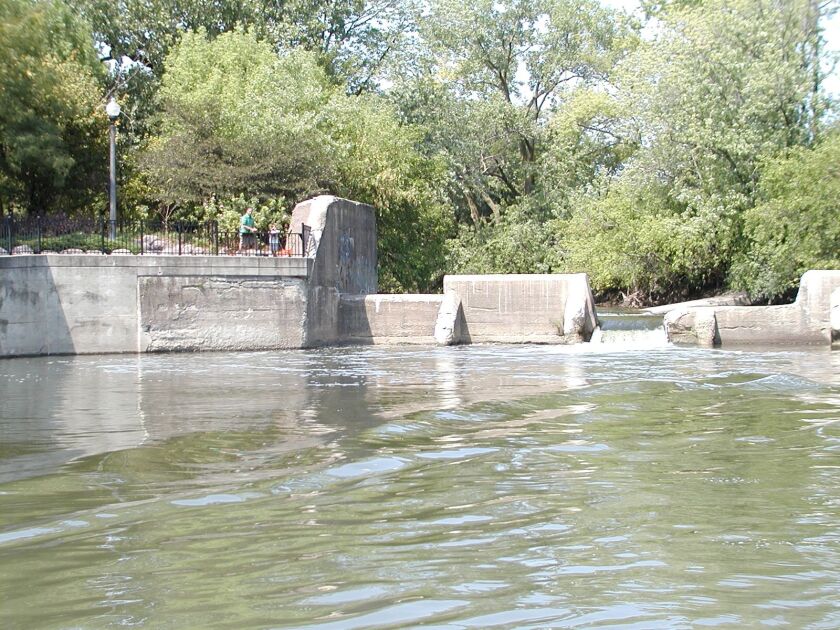 A family fishing in the summer of 2012 below the former dam on the North Branch at the confluence with the North Shore Channel.<br>Dale Bowman/Sun-Times
