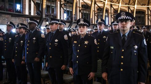 Recruits take an oath of office during a Chicago Police Department graduation ceremony at the Aon Grand Ballroom at Navy Pier, Tuesday morning, March 7, 2023. | Ashlee Rezin/Sun-Times