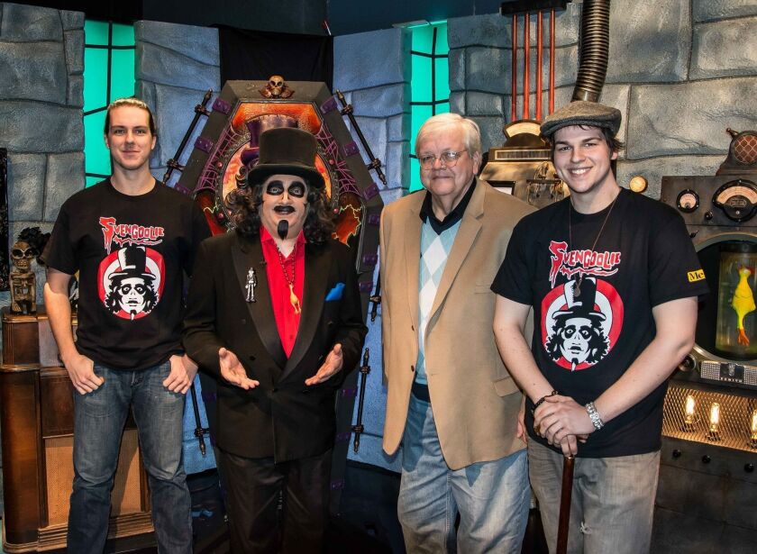 Zay Smith enjoyed an opportunity to take his son Bryant (far left) and Zachary to meet TV’s Svengoolie, a fellow punster.