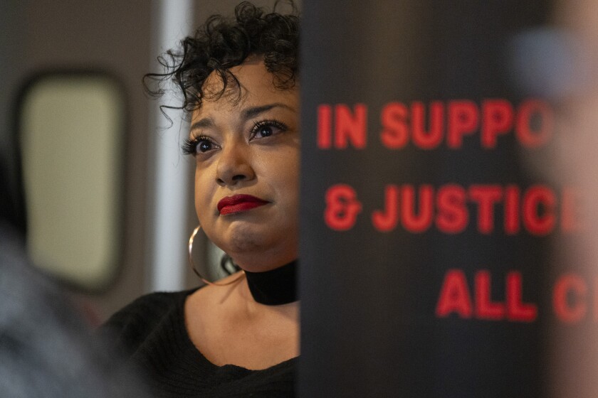 Aislinn Pulley, co-executive director of the Chicago Torture Justice Center, attends a gathering at Carnitas Uruapan in Little Village, where Black organizers expressed their support for immigrants and encouraged Black and Latino communities to stand together, Saturday, Dec. 6, 2025. | Sun-Times Staff
