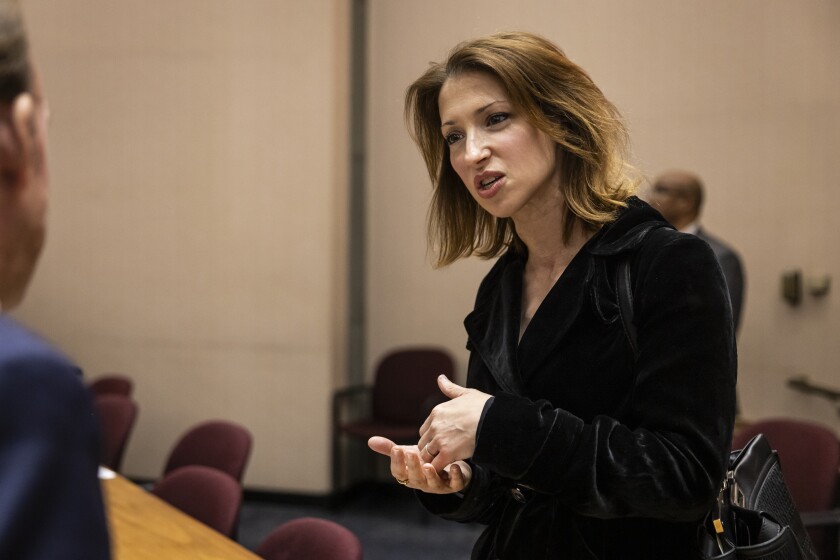 Chicago Inspector General Deborah Witzburg chats with alderpeople before the start of a Chicago City Council meeting at City Hall, Wednesday, April 16, 2025.
