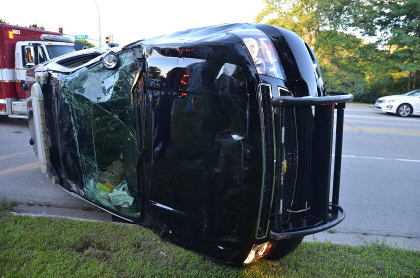 An Oak Brook police officer was hurt when a squad car and another crashed Tuesday night. | Oak Brook police